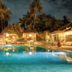 Les Villas Ottalia Yoga & Diving, Gili Meno: tropical pool with villas and palm trees at night