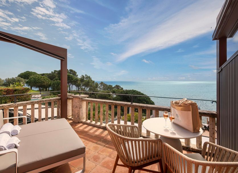 Hotel Cala del Pi - Adults Only terrace with sea view and loungers in Platja d'Aro