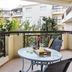 Artemis Cynthia Complex in Paphos balcony with table, chairs, and garden view