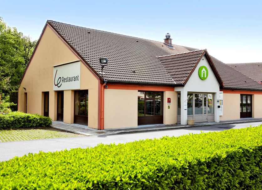 Campanile Maubeuge hotel exterior in Maubeuge with restaurant entrance and hedged landscaping