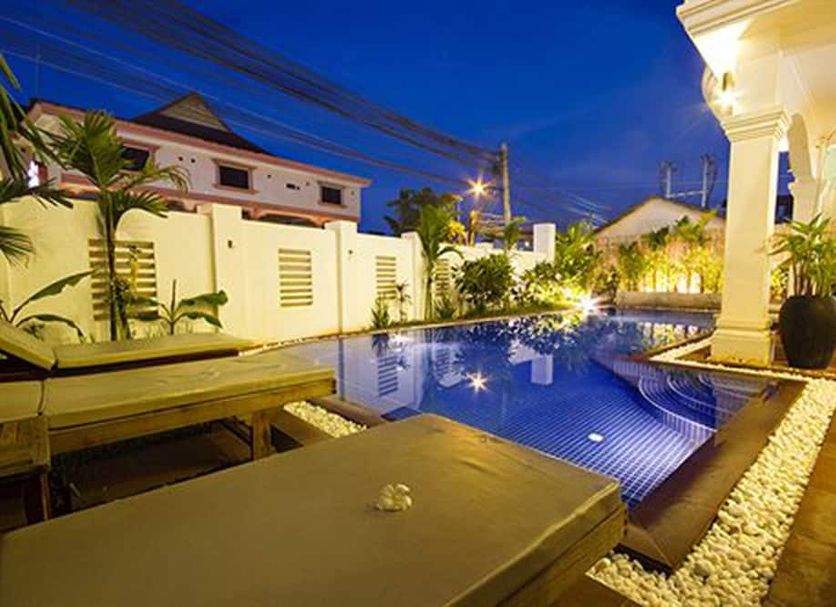 King Boutique in Siem Reap with illuminated outdoor pool and lounge area at night