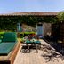 Hacienda Zorita Wine Hotel & Spa in Valverdón with a sun lounger patio outside a stone villa