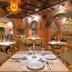 Hotel El Marqués by Faranda Boutique in Cartagena, elegant restaurant with arched brick walls and set tables