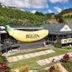 Matador Motor Inn in Coffs Harbour, exterior with The Big Banana and cafe sign on a hillside