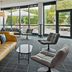Four Points Flex by Sheraton Ratingen Düsseldorf Airport lounge with seating and large windows in Ratingen