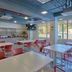 City Express Junior by Marriott Guadalajara Periférico Sur breakfast area with red chairs and tables in Tlaquepaque