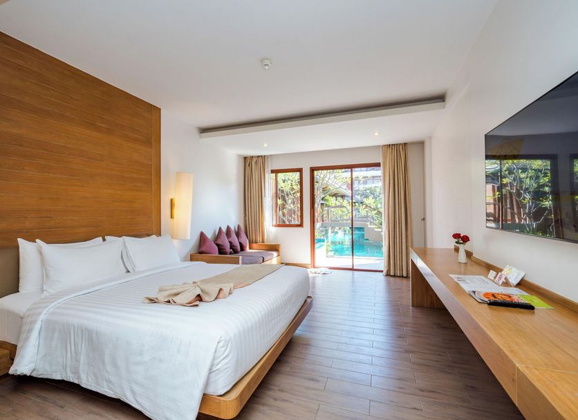 Ayrest Hua Hin Hotel room with king bed, balcony doors and pool view in Hua Hin