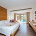Ayrest Hua Hin Hotel room with king bed, balcony doors and pool view in Hua Hin