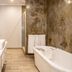 Anew Resort White River Mbombela bathroom with soaking tub, vanity, and tiled floor in White River