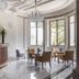 Villa Genesis Menton elegant hotel lounge with curved bar, chandeliers and seating by tall windows