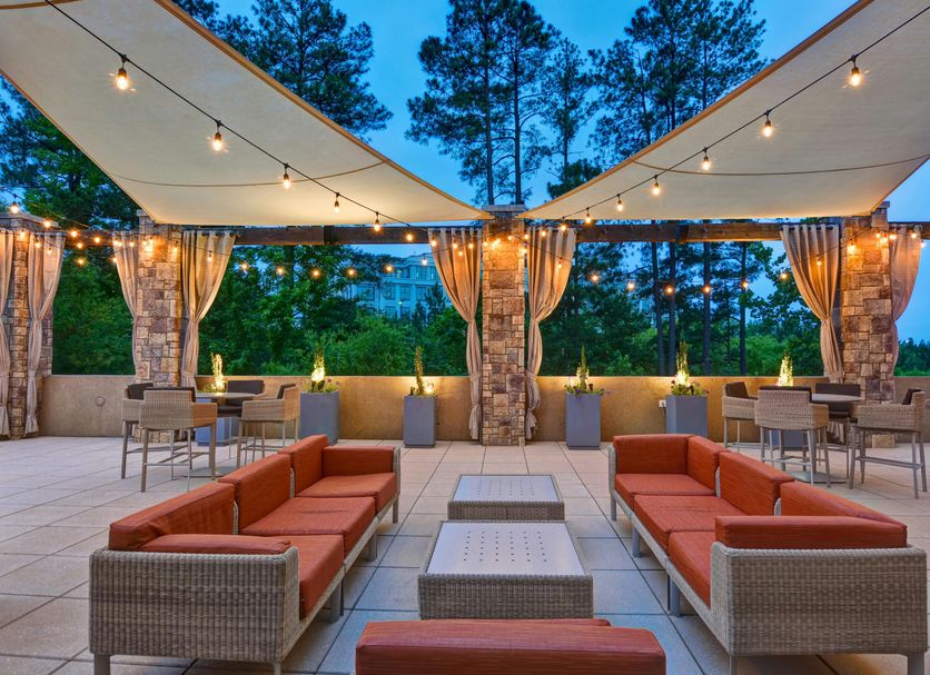 Embassy Suites by Hilton Raleigh Durham Airport Brier Creek terrace with seating and string lights in Raleigh