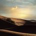 Kenzi Rissani in Errachidia with sunset over desert dunes and rolling sand hills