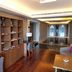 Oakwood Residence Kapil Hyderabad lobby lounge with wood floors, seating, shelving and indoor pool