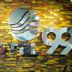 Hotel 99 Cubao sign on a patterned brick wall in Manila