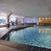 Indoor pool at Romantik Hotel Kasteel Daelenbroeck in Herkenbosch with lounge chairs and spa lighting