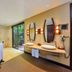 Trou Aux Biches Beachcomber Golf Resort & Spa bathroom with soaking tub, double vanity and garden view