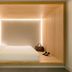 Zedwell Piccadilly Circus in London, minimalist wood-paneled hotel room with a bed and soft backlighting