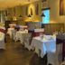 Le Voyageur Inn in Mattawa dining room with white tablecloth tables and burgundy booth seating