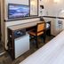 Toyoko Inn Gumma Isesaki Ekimae guest room with desk, TV, mini fridge and bed in Isesaki