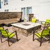 SpringHill Suites by Marriott Woodbridge rooftop fire pit seating area with lime green chairs