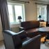 Älgbergets Bed & Breakfast lounge in Stenungsund with leather seating and round table