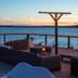 Aqua by American Beech - Adults Only waterfront deck with lounge seating and sunset bay views in Aquebogue