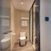 Hanting Hotel Zibo Jinjing Avenue Municipal Government bathroom with toilet, shower and wall-mounted sink