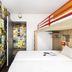 hotelF1 Amiens Est in Glisy, compact room with bunk bed and colorful poster-covered walls
