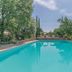 Borgo Nuovo San Martino in Ambra with a turquoise outdoor pool and landscaped garden views