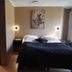 Trudvang Apartment Hotel in Rena bedroom with en-suite bathroom and double bed