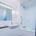 Travelodge Birmingham Yardley bathroom with bathtub, shower, sink and blue gradient curtain in Birmingham