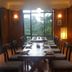 The Fort Resort Nagarkot dining room with long table and forest views through large windows