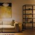 Boutique Hotels Manna & Blue Nijmegen lounge with beige sofa, abstract art, floor lamp and shelving