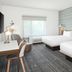 TownePlace Suites by Marriott Pigeon Forge guest room with two beds, window seat and desk