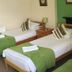 The Kings Arms London triple room with three single beds and green accents