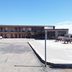 OYO Hotel Kings At Clovis exterior with parking lot, two-story motel building, and picnic tables