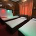Sudha's Garden Home Kathmandu room with three single beds and warm curtain-lit interior