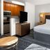 TownePlace Suites by Marriott Ontario Airport room in Rancho Cucamonga with king bed, TV, and kitchenette