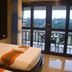 Phu Chom Mork Resort in Sangkhla Buri room with twin beds and balcony view