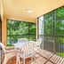 Vacation Village at Bonaventure, Weston: screened balcony with patio table, chairs and lake view