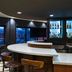 Courtyard by Marriott Scottsdale Old Town bar lounge with curved counter and illuminated bottle display