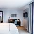 Premier Inn Lübeck City Centre room with double bed, desk, wall-mounted TV and curtains in Lübeck