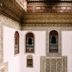 La Maison Bleue Batha in Fez, ornate Moroccan courtyard with arched windows and carved tilework