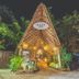 The Beach Tulum Hotel entrance with thatched archway and tropical lighting in Tulum