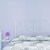 Sfumature Partenopee Naples room with white wrought-iron bed, striped bedding and purple lamps