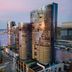 The Ritz-Carlton, Perth waterfront hotel towers over the river at sunset in Perth