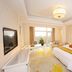Dongjiao State Guesthouse Nanjing guest room with king bed, desk, TV, and large window
