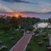 Sunset view from Chariot Beach Resort, Mahabalipuram, over gardens and outdoor seating toward the sea