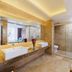 Marriott Hotel Yunfu bathroom with double sink vanity, glass shower enclosure and bathtub
