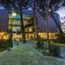Zafiro Alzinar Mar in Can Picafort, exterior at dusk with lit balconies, trees, and garden walkway